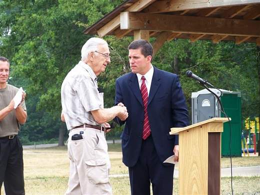 Dean welcomes former Mayor John Petruska at the July 14, 2005 re-dedication of